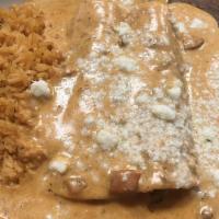 Enchiladas En Crema · Two enchilada stuffed with choice of cheese, shredded beef, ground beef or chicken. Topped w...