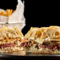 Stk Sandwich* · Shaved coffee-rubbed ribeye steak topped with caramelized onions, Gruyere cheese & horseradi...