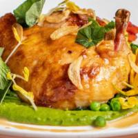 Free Range Chicken · Roasted chicken served with peas & beans, confit garlic & mustard seed chicken jus.