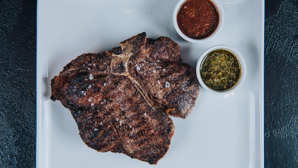 Dry-Aged Porterhouse 28 Oz* · 28 oz dry-aged beef porterhouse steak cooked to the desired temperature & choice of 2 STK sauces.