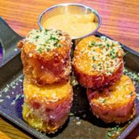 Tater Tots · Crispy tater tots filled with Cheddar, Jack, Parmesan & fontal cheese's. Fried, seasoned & t...