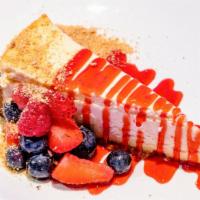 Cheesecake · Traditional cheesecake served with berries & raspberry coulis.