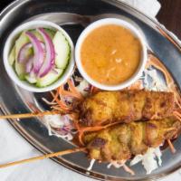 Satay Chicken · Specially marinated chicken on skewers served with our peanut sauce and cucumber salad.