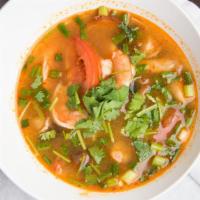 Tom Yum W/ Chicken · Lemongrass, lime leaves and galangal infused broth, mushrooms, tomatoes and lime juice with ...