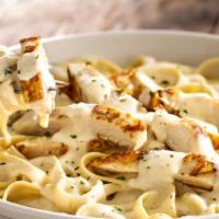 Chicken Fettuccine Alfredo  · A traditional creamy favorite with chicken, Parmesan and Romano cheeses tossed in fettuccini...