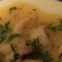 Shrimp & Grits  · Features creamy grits with parmesan cheese topped with sautéed shrimp swimming in butter, ga...