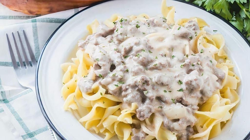 Ground Beef Stroganoff  · Ground beef smothered in mushroom cream sauce served over egg noodles. Comes with bread. Tax included.