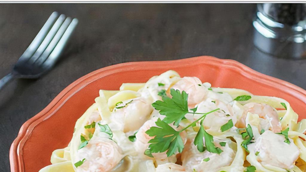 Shrimp Fettuccine Alfredo  · A traditional creamy favorite with chicken, parmesan and Romano cheeses tossed in fettuccini pasta. Comes with bread. Tax included.