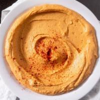 Hummus - Regular · Vegan. Garbanzo beans, garlic, tahini sauce topped with olive oil served with 1 pita bread.