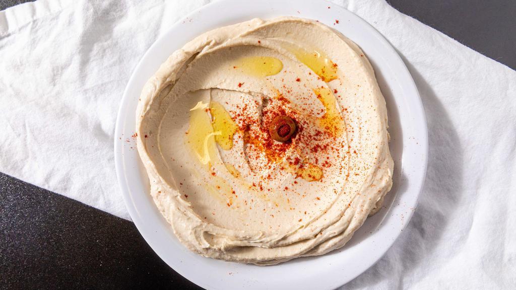 Spicy Hummus · Vegan. Garbanzo beans, garlic, tahini sauce, and our signature spicy blend topped with olive oil served with 1 pita bread.