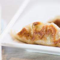 Gyoza Dumplings · Pan fried 6 pcs of pork and vegetable dumplings. Served with homemade sauce on side.