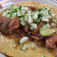 Carnitas Taco · Salsa verde, onion, cilantro