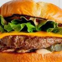 Cheeseburger · Fresh, never frozen patty with American cheese on a brioche bun with fry sauce, lettuce and ...