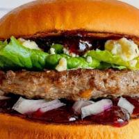 Huckleberry Burger · An Idaho favorite. A Fresh, never frozen patty on a brioche bun with fresh huckleberry sprea...
