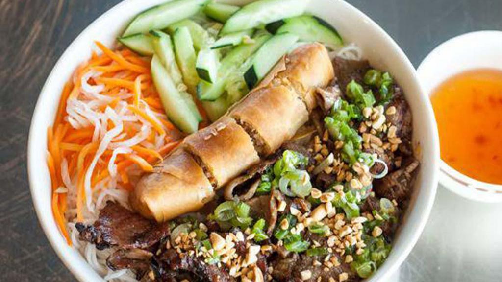 Bún Thịt Nuông Cha Gio · Grilled pork and fried egg rolls on vermicelli noodles.