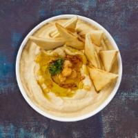 Hummus Pita · Cooked and mashed chickpeas blended with tahini, lemon juice, and garlic served with pita br...