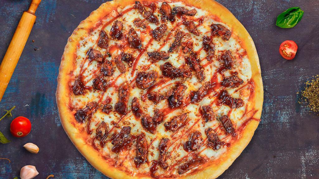 Beef Or Lamb Sheesh Pizza · Ground beef or lamb, marinated ginger, garlic, and green chile baked on a hand-tossed 12