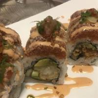 Zushi Roll · Shrimp Tempura, avocado, cucumber, seared spicy tuna on top with chives, roasted garlic and ...