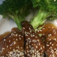 Sesame Chicken · Hot & spicy. Hot crispy chunks of chicken with chef's special sauce on broccoli bed top with...