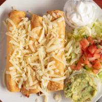 Three Rolled Tacos Plate · Includes rice, beans, guacamole, cheese, sour cream, lettuce, and pico de gallo.