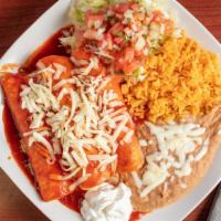 Three Enchiladas Plate · Includes rice, beans, and sour cream.
