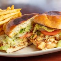 Adobada Torta · Includes beans, lettuce, tomatoes, onions, and guacamole.