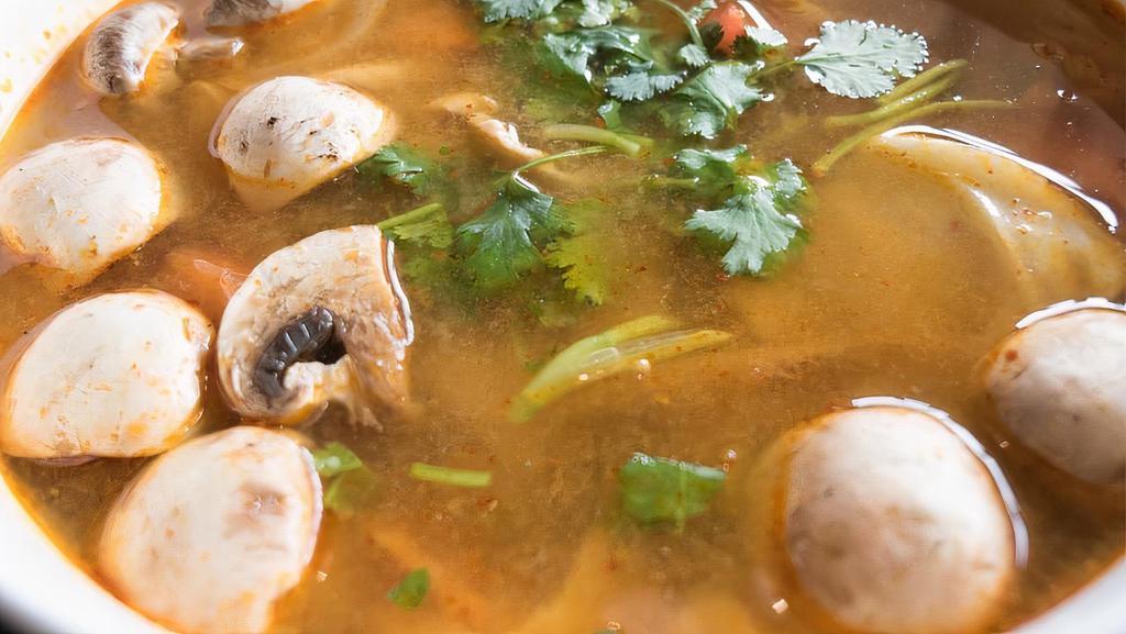 Tom Yum Soup · Traditional Thai hot and sour soup. Your choice of chicken, pork, or tofu, with galangal, lemongrass, kaffir lime leaves, mushroom, tomato, lime juice, fish sauce, onion, cilantro, and egg.