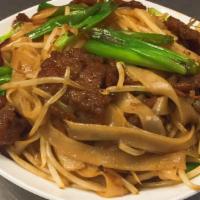Chow Fun Noodles · White flat Chinese rice noodle with bean sprouts green onions in house stir fry.