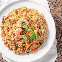 Com Chien Duong Chau · Fried rice with beef, chicken, bbq pork, shrimp, carrots, and peas.
