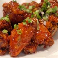 Yangnyeom Chicken Wings · Spicy. spicy and sweet Korean fried chicken wings, coated in mama's homemade sauce, served w...