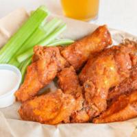 Fried Chicken Wings · 8 Fried Jumbo Party Wings. Tossed in sauce - BBQ, Honey Sriracha, or Buffalo Style. Served w...