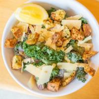 Kale Caesar · Kale, Shaved Aged Parmesan, Lemon Wedge, Housemade Croutons, and Lemon Caesar Dressing.