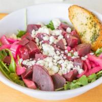 Beet Salad · Roasted Beets, Pickled Red Onion & Goat Cheese, on Arugula with a drizzle of Balsamic Vinaig...