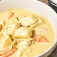 Yellow Curry · Yellow curry paste cooked with potatoes and carrots.