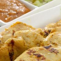 Chicken Satay  · Grilled chicken on skewers served with peanut sauce and cucumber sauce.