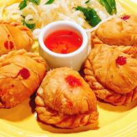 Thai Curry Puff With Sweet Bean (5) · Fried puff pastry filled with yellow curry, vegetarian sweet mung bean.