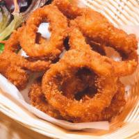 Fried Calamari  · Served with spicy cilantro sauce and sweet and sour sauce.