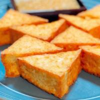 Fried Tofu (8)  · Vegetarian.  Gluten free. With a sweet and sour sauce with grounded peanut.