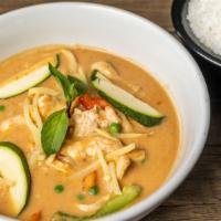 Red Curry · Red curry paste cooked with bamboo shoots, bell peppers, Thai basil and coconut milk.