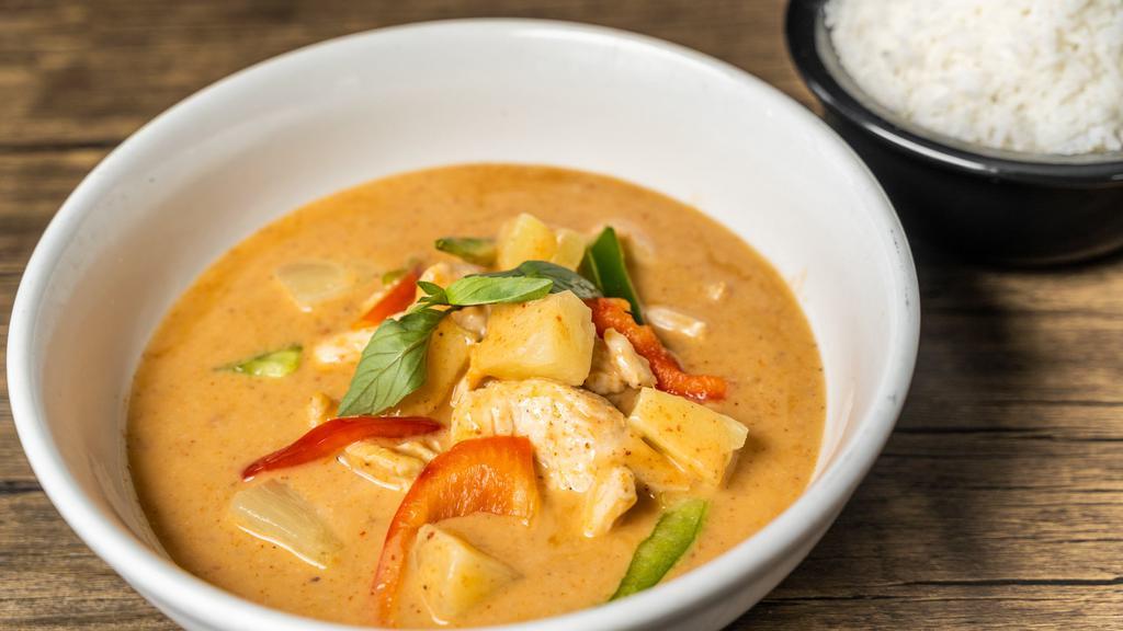 Pineapple Curry · Pineapple cooked in red curry with bell peppers and Thai basil.