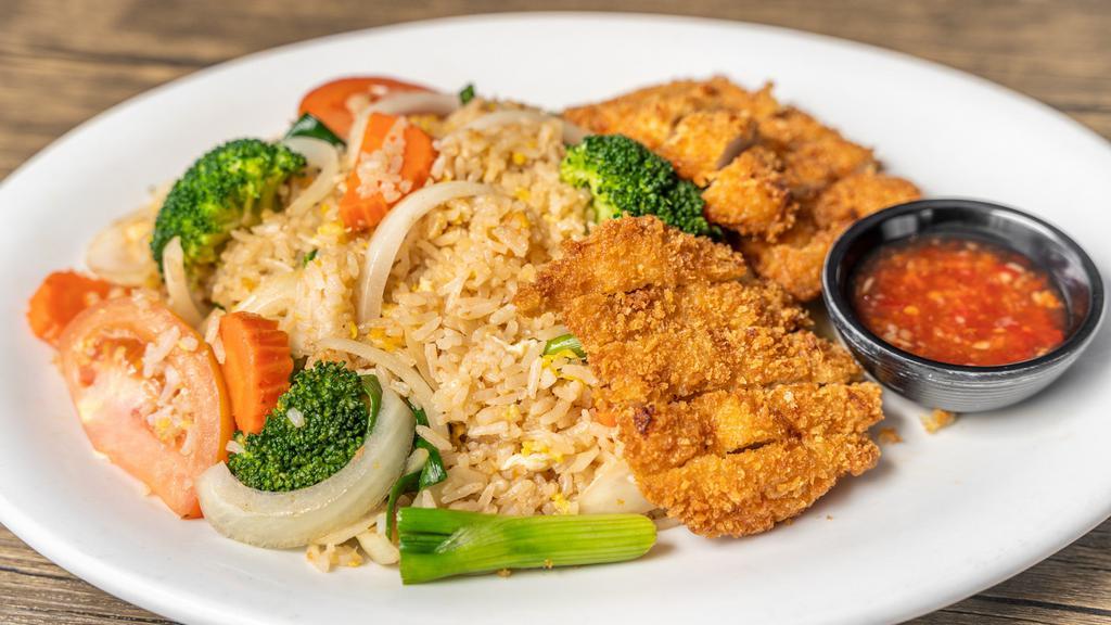 Thai Fried Rice With Crispy Chicken  · Thai jasmine rice stir with egg, tomatoes, carrots, onions, tomato, and broccoli topped with fried chicken.