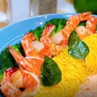 Garlic Noodle With Tiger Prawns · Stir fried egg noodles with garlic and basil served with grilled tiger prawns, broccoli, and...