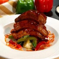 Roast Pork Ribs · Pork ribs roasted with cilantro, black pepper, and garlic served with steamed baby bok choy,...
