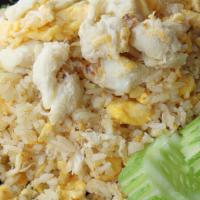 Dungeon Crab Fried Rice · Real crab meat stir with egg, tomatoes, carrots, onion, green onion, tomato, broccoli and ri...