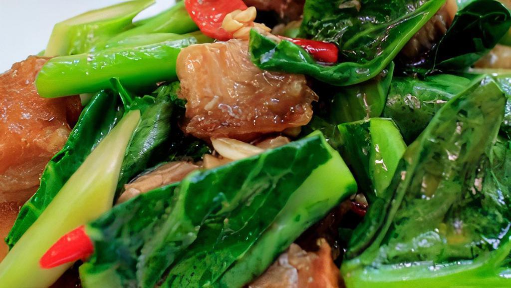 Chinese Broccoli With Crispy Pork · Chinese broccoli stir fried with crispy pork belly, garlic, chili, and oyster sauce.