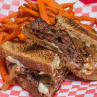 Luck Of The Irish · Two steakburger patties, swiss cheese, grilled onions and matty g's fry sauce on marble rye ...