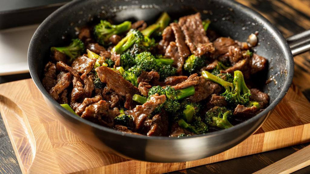 Broccoli Beef Bowl · Delicious bowl is full of stir-fry beef tossed in a combination of spicy-sweet sesame sauce, served over white rice.