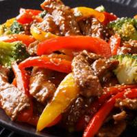 Teriyaki Beef Bowl · Delicious bowl is full of beef in homemade teriyaki sauce, broccoli, and carrots, served ove...