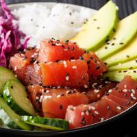 Poke Bowl · Delicious bowl is full of cubes of raw fish that are served in a bowl along with rice, dress...