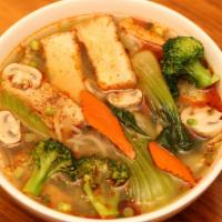Vegetarian Spicy Soup · Spicy. Vegetable Soup with Tofu, thick rice noodles, and vegetables: broccoli, mushroom, car...